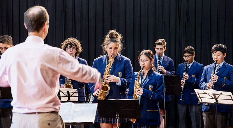 Music teacher with band at Gilroy Catholic College Castle Hill