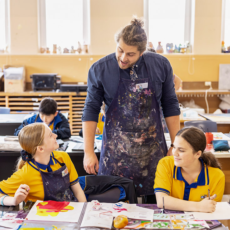 Art teacher helping students at Gilroy Catholic College Castle Hill
